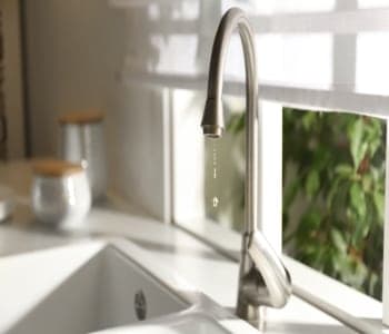 Featured image for article: The Top Causes of a Leaking Faucet and What to Do About It