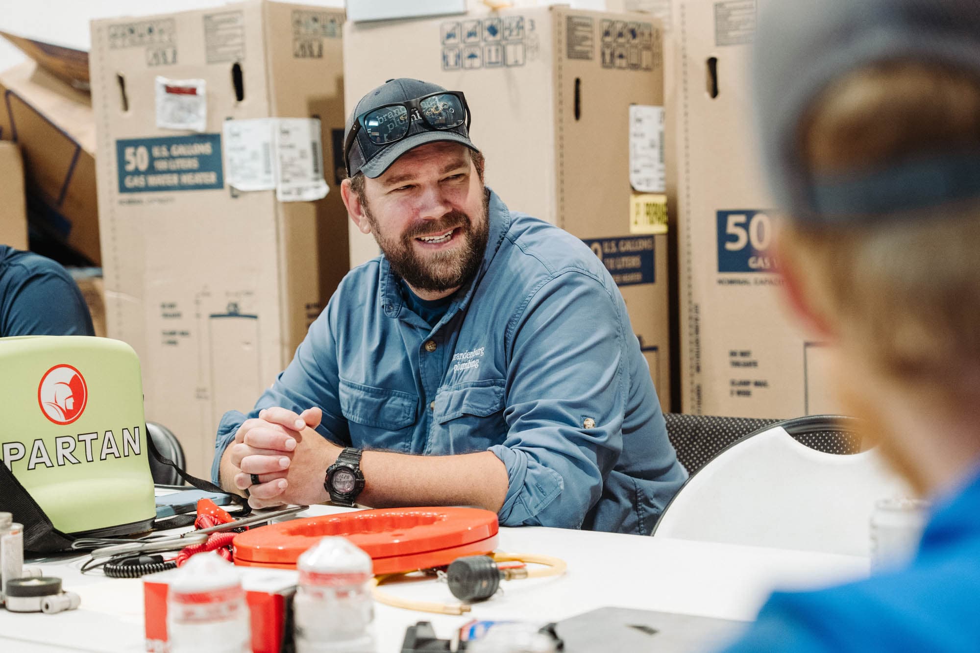 Plumber helping customer