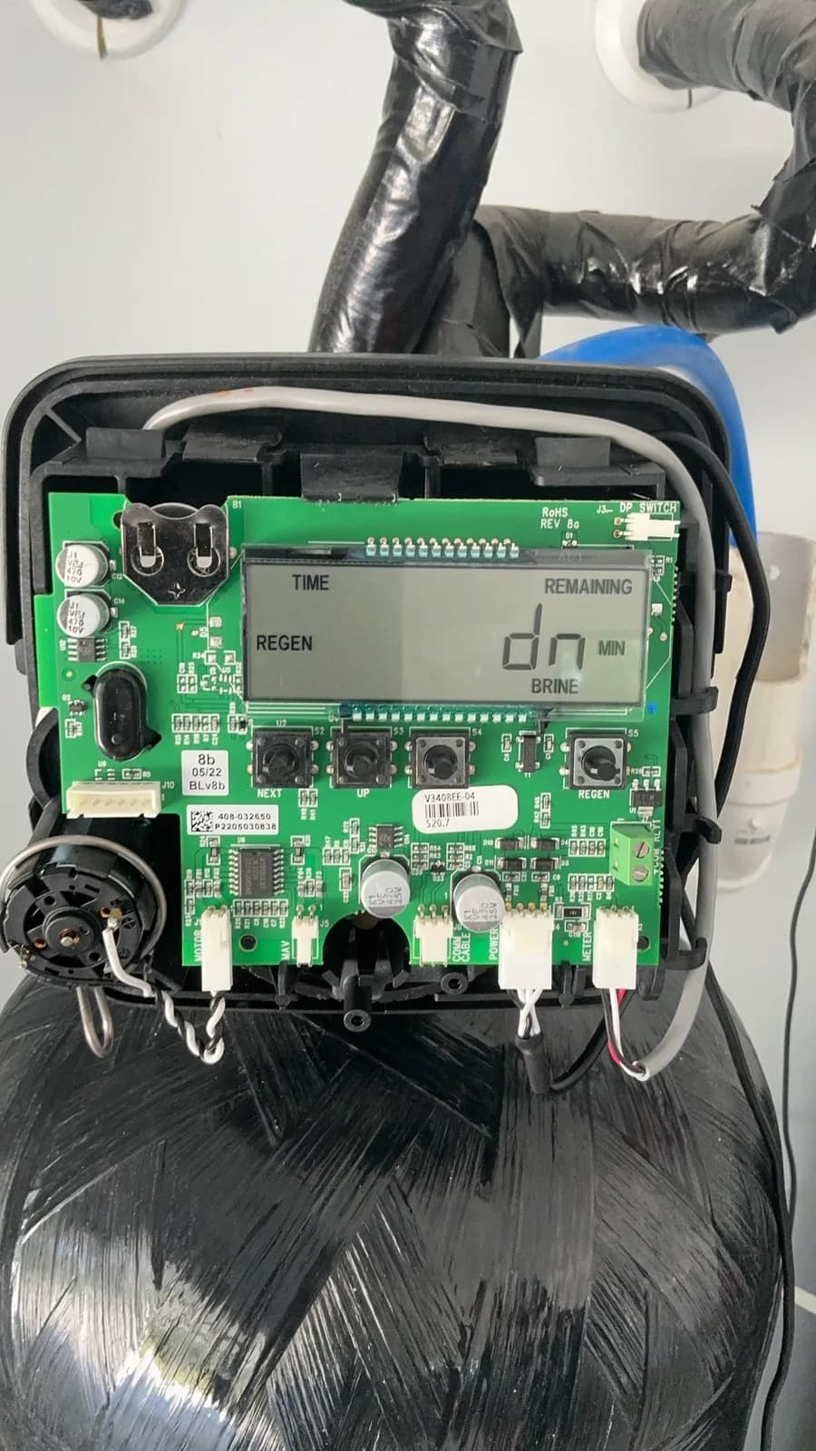 Open water softener control board during diagnostic service